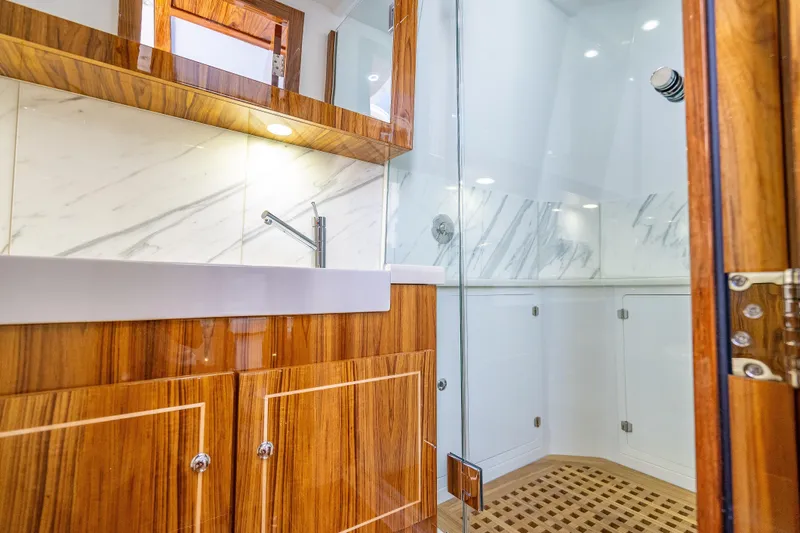  Yacht Photos Pics Luxurious bathroom in 2026 HCB 65 Estrella yacht with wood and marble finishes.