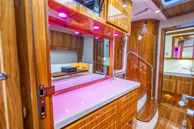  Yacht Photos Pics Luxurious interior of 2026 HCB 65 Estrella yacht with wood finish and modern lighting.
