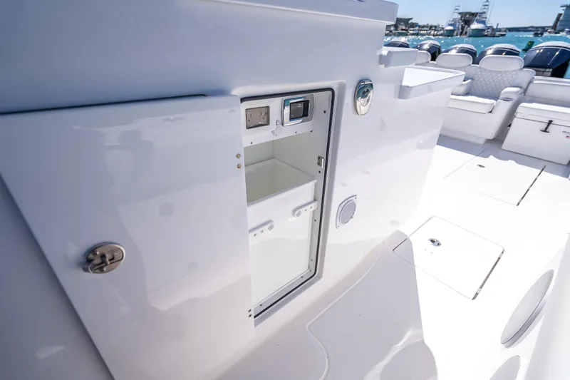  Yacht Photos Pics Open storage compartment on 2026 HCB 65 Estrella boat, showcasing sleek interior design.