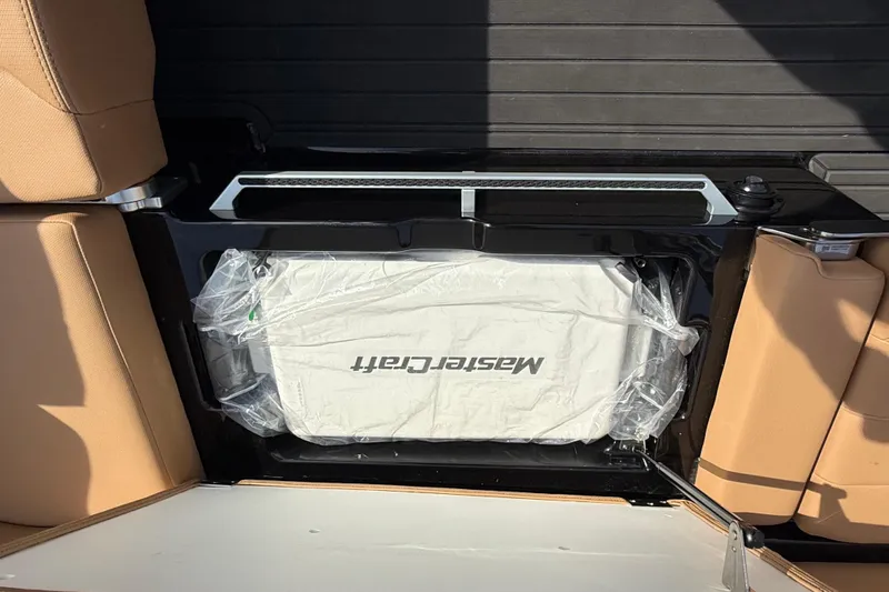  Yacht Photos Pics 2026 MasterCraft XT24 boat interior with tan seats and branded cooler.