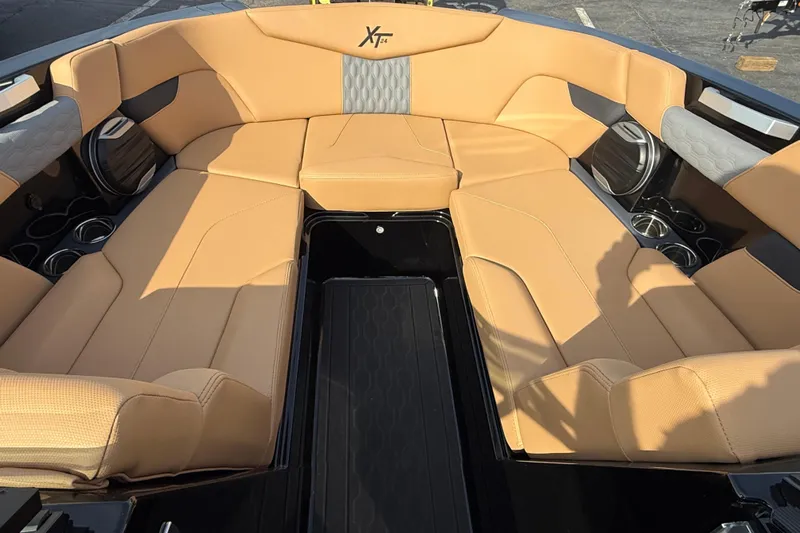  Yacht Photos Pics Luxurious interior of 2026 MasterCraft XT24 boat with tan seating and cup holders.