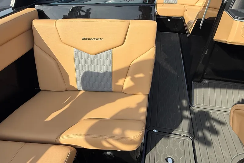  Yacht Photos Pics 2026 MasterCraft XT24 boat interior with tan and gray seating, showcasing luxury design.