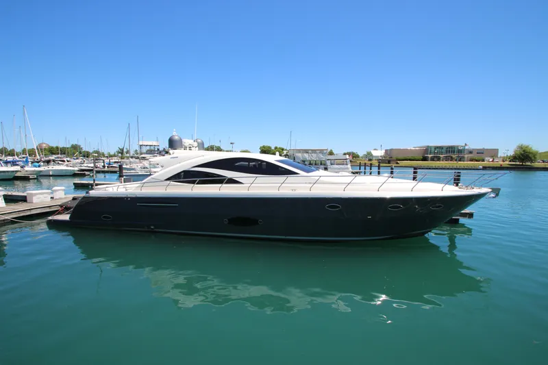  Yacht Photos Pics Luxury 2007 Uniesse 70 Sport yacht docked in marina under clear blue sky.