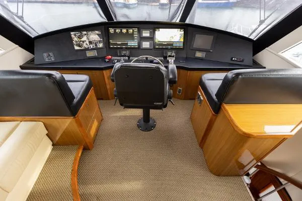 Chona Yacht Photos Pics 2007 Viking 64 Enclosed helm with modern navigation equipment and comfortable seating.