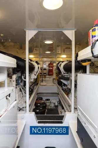 Chona Yacht Photos Pics Engine room of a 2007 Viking 64 Enclosed yacht, showcasing machinery and equipment.