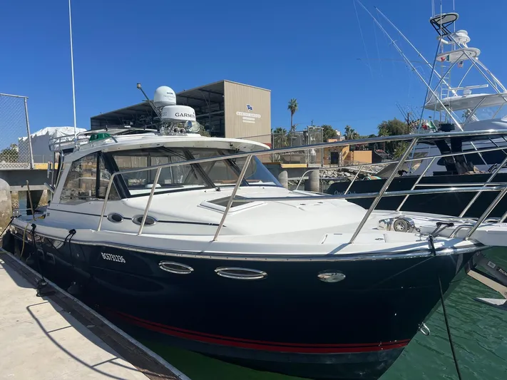  Yacht Photos Pics 2017 Cutwater C-302 Sport Coupe docked at marina under clear blue sky.