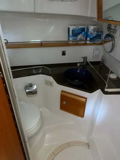  Yacht Photos Pics 2017 Cutwater C-302 Sport Coupe bathroom with toilet, sink, and storage.