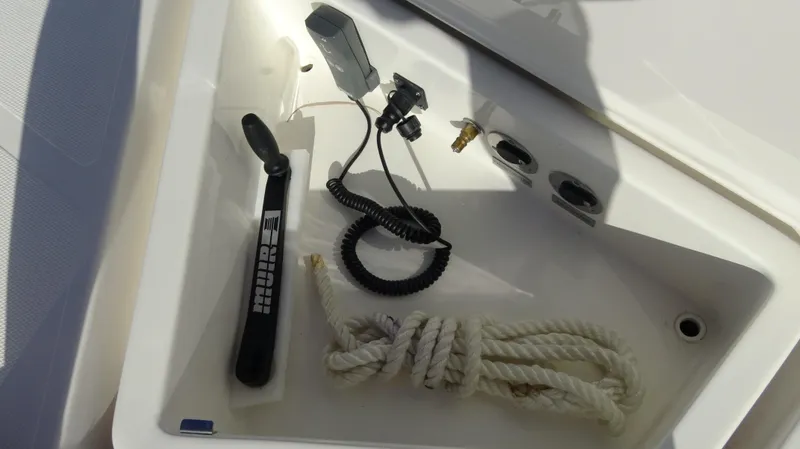 Chapter II Yacht Photos Pics Storage compartment in 2023 Riviera 6000 Sport Yacht with rope and equipment.