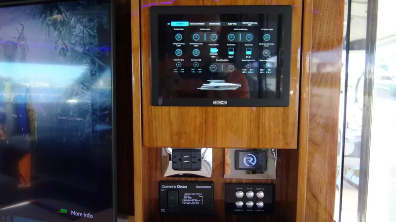 Chapter II Yacht Photos Pics Control panel of 2023 Riviera 6000 Sport Yacht with touchscreen interface.