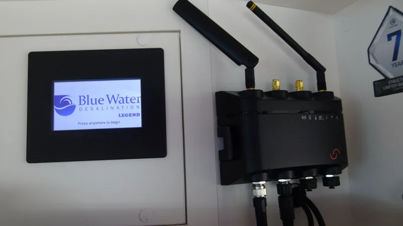 Chapter II Yacht Photos Pics Control panel and device in 2023 Riviera 6000 Sport Yacht, featuring Blue Water Desalination system.