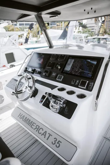 Hull 136 Yacht Photos Pics 2025 Hammer Yachts HammerCat 35 helm with advanced navigation controls and sleek design.