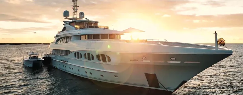 Hull 136 Yacht Photos Pics Luxurious Hammer Yachts HammerCat 35, 2025 model, sailing at sunset on open water.