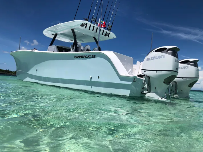 Hull 136 Yacht Photos Pics 2025 Hammer Yachts HammerCat 35 in clear turquoise water, featuring dual Suzuki engines.