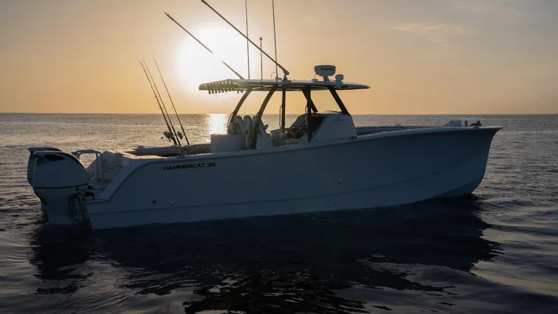 Hull 136 Yacht Photos Pics 2025 Hammer Yachts HammerCat 35 at sunset on calm waters.