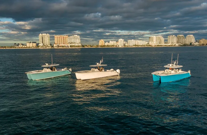 Hull 136 Yacht Photos Pics Three HammerCat 35 yachts on water with city skyline in background, 2025 model.