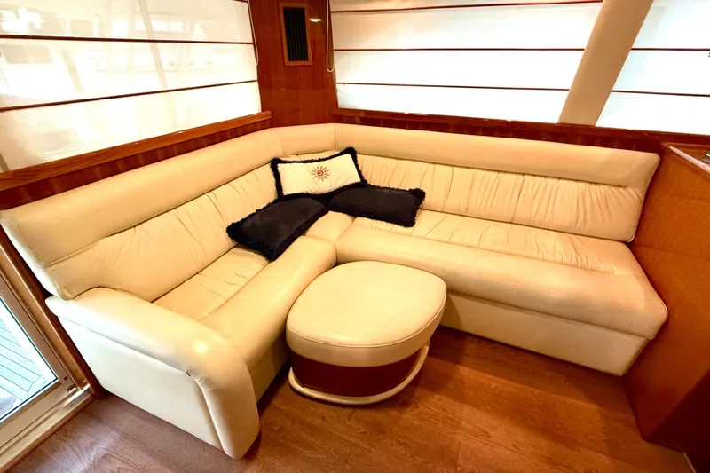 Golden Rule Yacht Photos Pics Luxurious interior of 2006 Riviera 42 Flybridge yacht with cream leather seating.