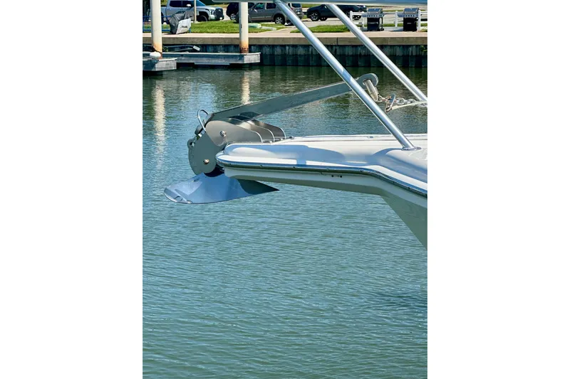 Golden Rule Yacht Photos Pics Bow of 2006 Riviera 42 Flybridge yacht with anchor in marina.