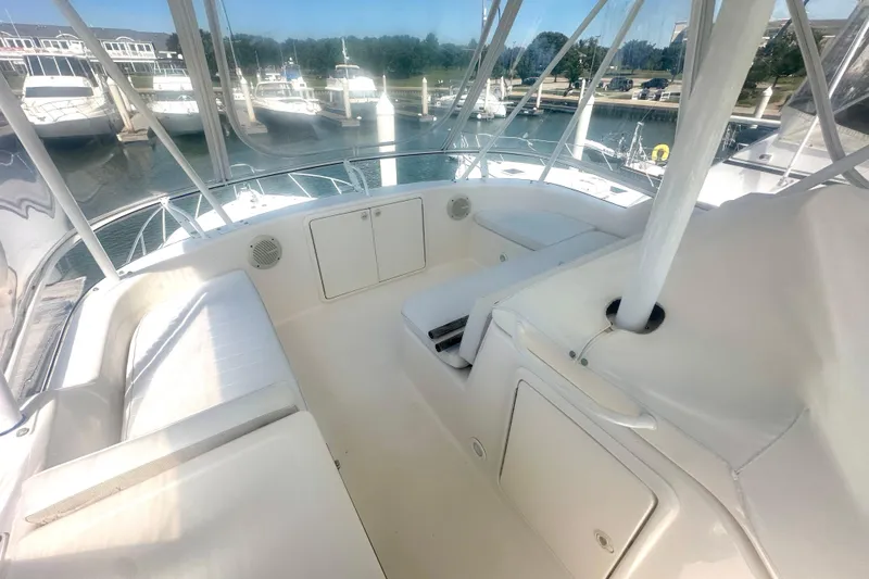 Golden Rule Yacht Photos Pics 2006 Riviera 42 Flybridge yacht interior with white seating and marina view.