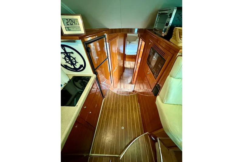 Golden Rule Yacht Photos Pics Interior of 2006 Riviera 42 Flybridge yacht with wooden flooring and modern amenities.