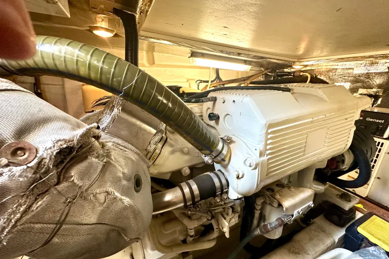 Golden Rule Yacht Photos Pics Engine room of 2006 Riviera 42 Flybridge yacht, showcasing mechanical components and systems.