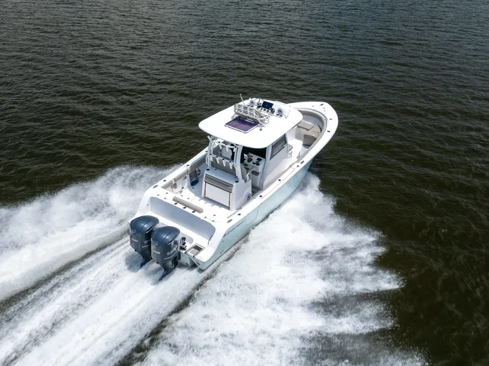  Yacht Photos Pics 2021 Sportsman Open 302 Center Console boat cruising on open water.