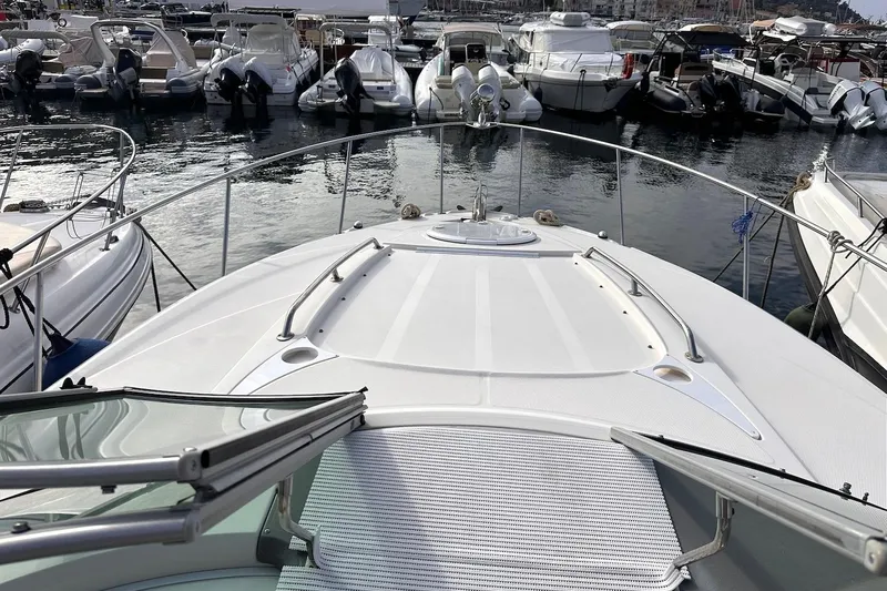 Key West Yacht Photos Pics 2011 Monterey 315 SCR boat docked in a marina with other vessels.