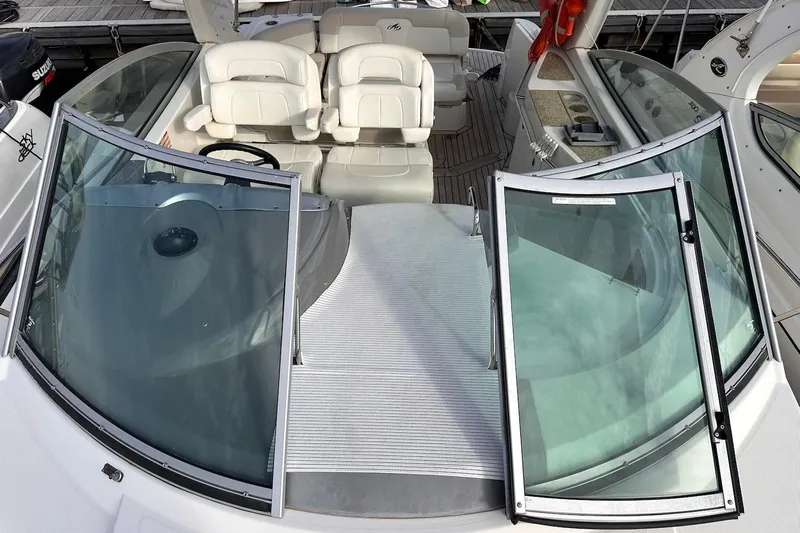 Key West Yacht Photos Pics 2011 Monterey 315 SCR boat interior with open windshield and seating area.