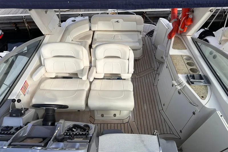 Key West Yacht Photos Pics 2011 Monterey 315 SCR boat interior with white seating and control panel.