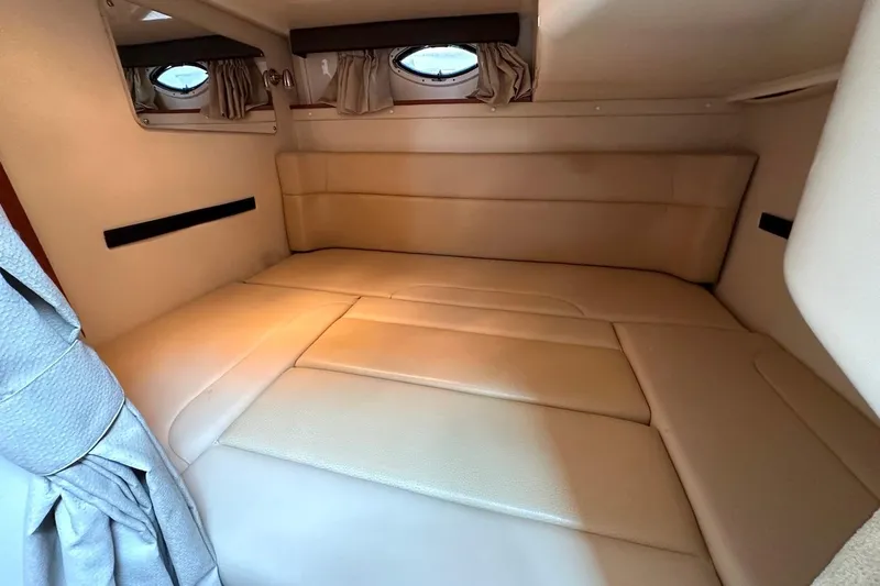 Key West Yacht Photos Pics Luxurious interior cabin of 2011 Monterey 315 SCR boat with beige upholstery.