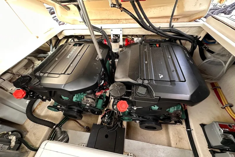 Key West Yacht Photos Pics Engine compartment of a 2011 Monterey 315 SCR boat, featuring dual Volvo Penta engines.