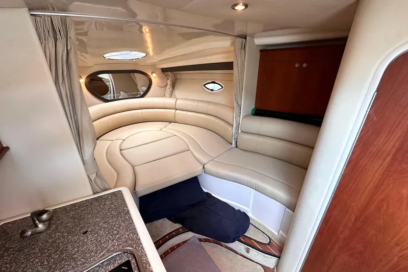 Key West Yacht Photos Pics Luxurious interior of 2011 Monterey 315 SCR boat with plush seating and elegant design.