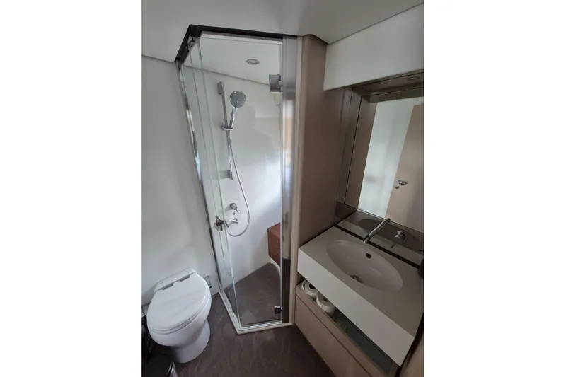  Yacht Photos Pics Bathroom interior of 2023 Azimut Fly 68 yacht with shower, sink, and toilet.