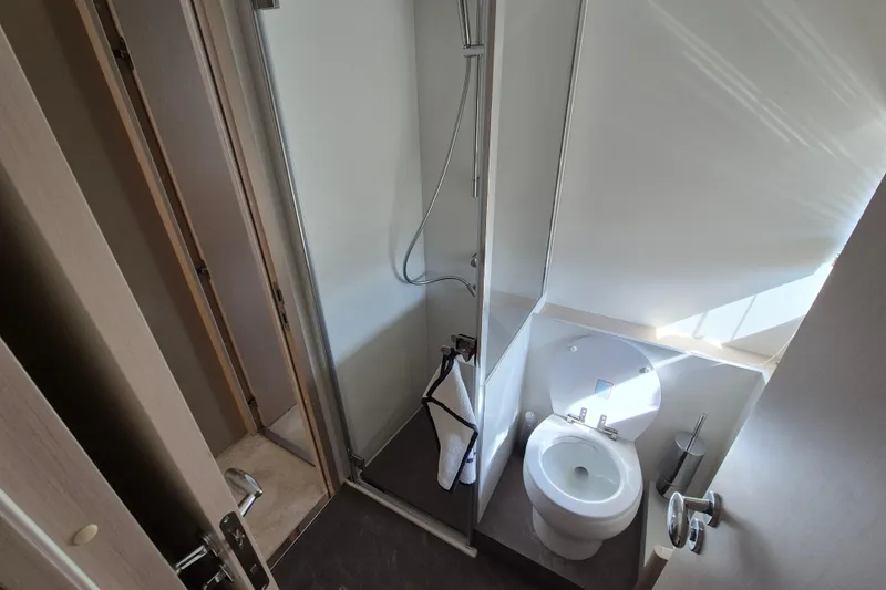  Yacht Photos Pics Bathroom interior of 2023 Azimut Fly 68 yacht, featuring shower and toilet.