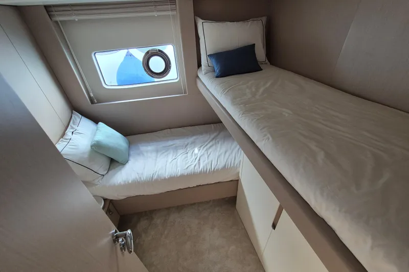  Yacht Photos Pics 2023 Azimut Fly 68 yacht cabin with bunk beds and window view.