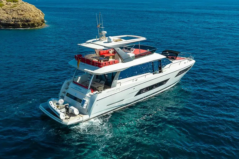  Yacht Photos Pics Luxurious 2017 Prestige 680 yacht cruising in clear blue waters.