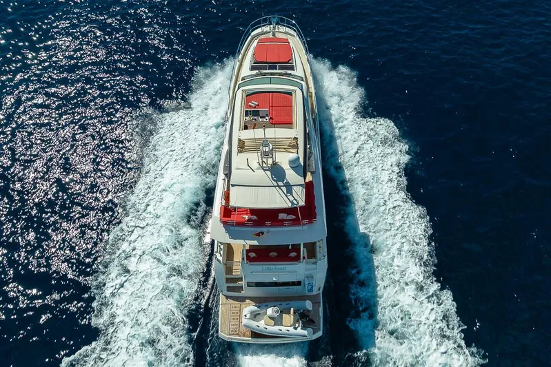  Yacht Photos Pics Aerial view of 2017 Prestige 680 yacht cruising on open water.