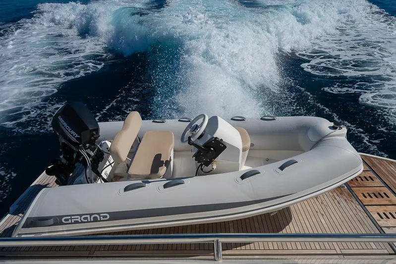  Yacht Photos Pics Inflatable boat on Prestige 680 yacht, 2017 model, cruising with wake in the background.