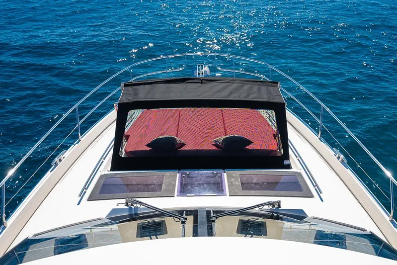  Yacht Photos Pics Luxury yacht Prestige 680, 2017 model, cruising on clear blue ocean waters.