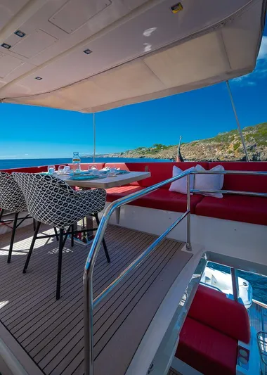  Yacht Photos Pics Luxury yacht deck with dining area, Prestige 680, 2017 model, scenic ocean view.