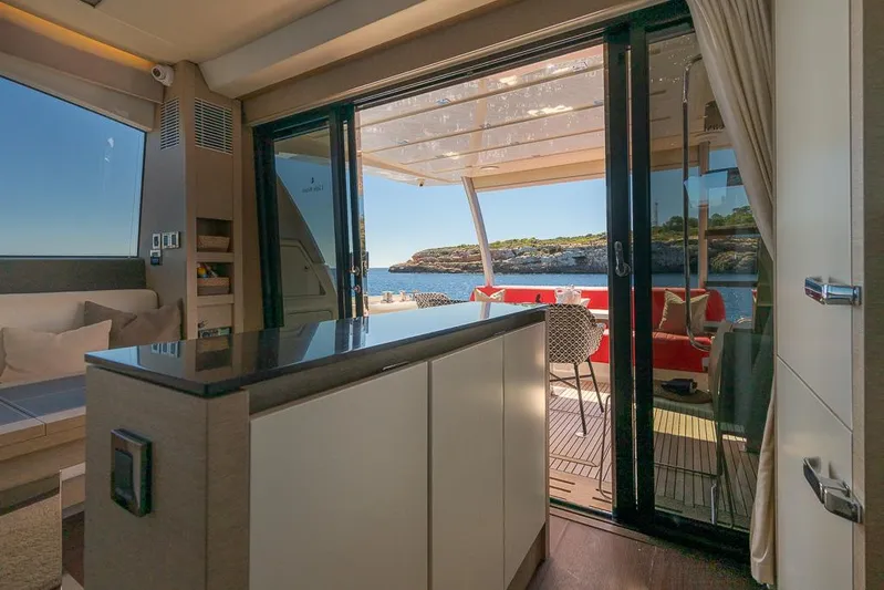  Yacht Photos Pics Luxurious interior of 2017 Prestige 680 yacht with ocean view through sliding doors.