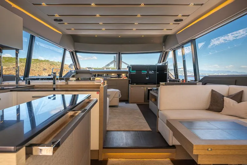  Yacht Photos Pics Luxurious interior of 2017 Prestige 680 yacht with modern furnishings and panoramic windows.