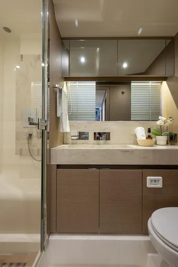  Yacht Photos Pics Luxurious bathroom interior of 2017 Prestige 680 yacht with modern fixtures and elegant design.