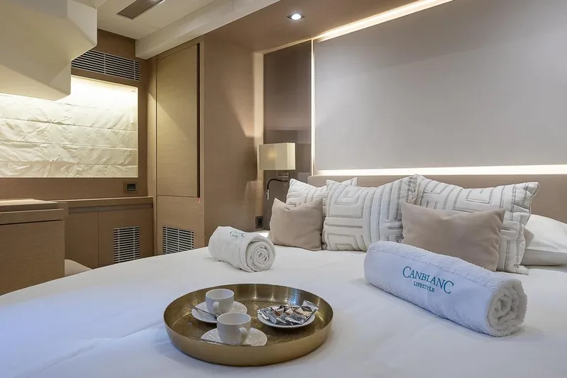  Yacht Photos Pics Luxurious bedroom interior on a 2017 Prestige 680 yacht with elegant decor and amenities.