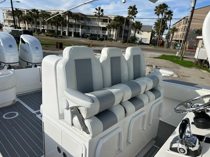  Yacht Photos Pics 2011 SeaHunter Center Console boat with cushioned seating and dual outboard motors.