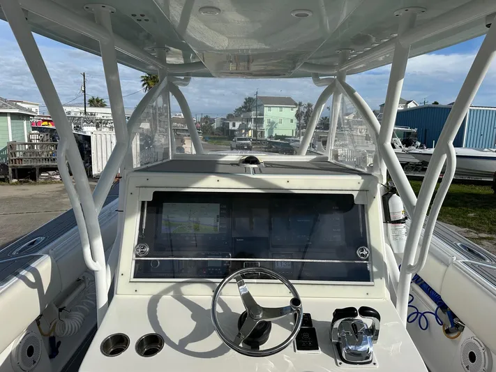  Yacht Photos Pics 2011 SeaHunter Center Console boat dashboard with steering wheel and navigation system.