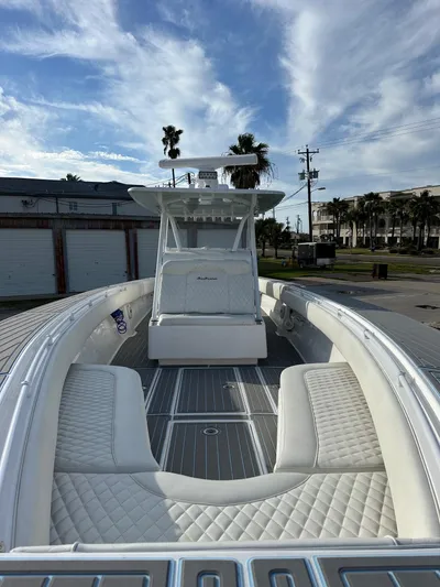  Yacht Photos Pics 2011 SeaHunter Center Console boat with white seating and open deck.