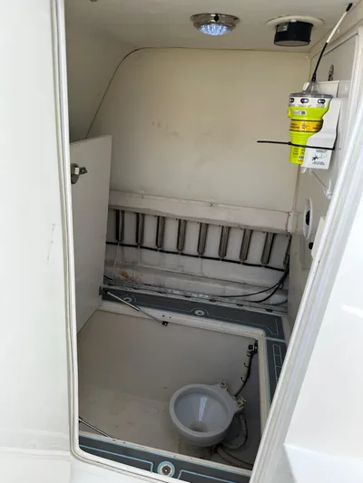  Yacht Photos Pics 2011 SeaHunter Center Console boat interior compartment with wiring and equipment.