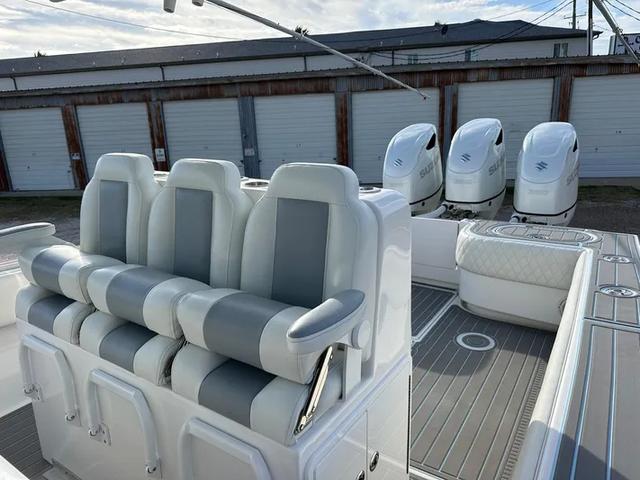  Yacht Photos Pics 2011 SeaHunter Center Console boat with quad engines and cushioned seating.