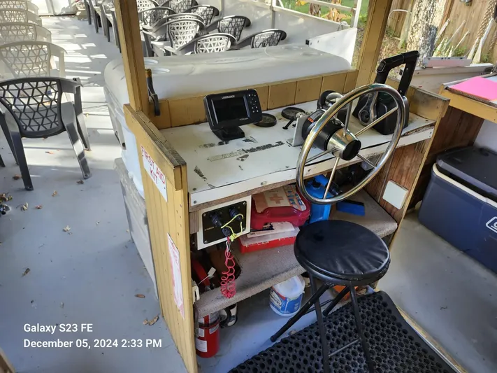 Sweet Tea Yacht Photos Pics 2016 Rover Marine Carolina Rover 40 helm with navigation equipment and seating area.