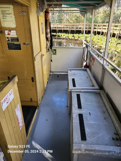 Sweet Tea Yacht Photos Pics Interior of 2016 Rover Marine Carolina Rover 40 with storage boxes and first aid kit.